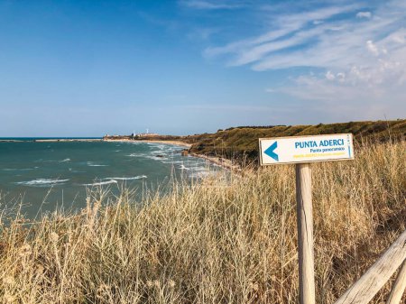 Photo for A sign indicating Punta Aderci panoramic viewpoint with the italian sea. Punta Aderci nature reserve, Vasto, Chieti, Italy - Royalty Free Image