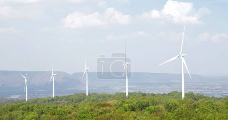 Photo for Beautiful sunny and wind turbine mountain landscape. Wind turbines on top of a mountain. Wind energy, Wind power, renewable energy - Royalty Free Image