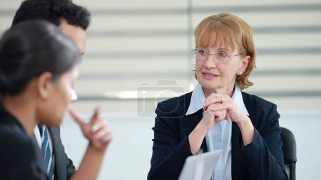 Photo for Businesswoman manager talking and disscussed brainstorming strategy of company growth with colleagues at boardroom meeting - Royalty Free Image