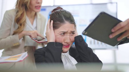 Photo for Young asian businesswoman working feels furious stressed, having problems at work and angry upset - Royalty Free Image