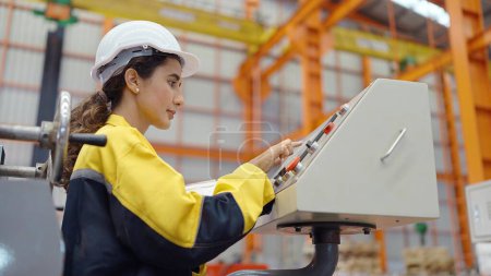 Photo for Hispanic latina women professional engineer worker working with electronic industry machine in factory check control machine construction installation - Royalty Free Image