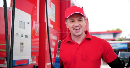 Photo for Portrait of worker employee in workwear uniform with fuel pump nozzle looking camera at gas station service - Royalty Free Image