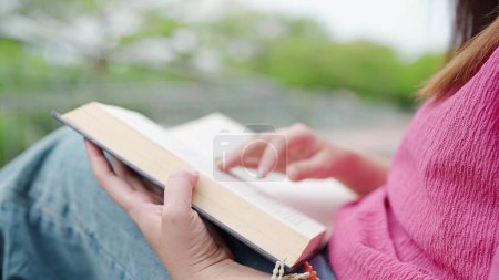 Photo for Close up student teenager woman preparing for college test, exam, reading book. Women read books in quiet nature. Leisure and relaxation concept - Royalty Free Image