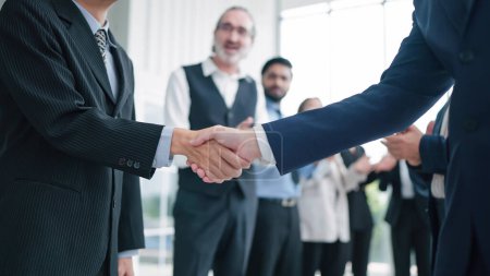 Photo for Close up shaking hands of business people close deal making agreement after successful meeting. Business partners shake hands. Business workers clapping hands on background. Partnership concept - Royalty Free Image