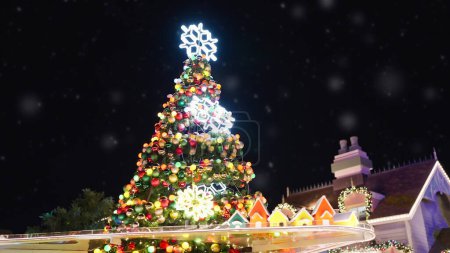 Photo for Decorated Christmas tree with balls and lights outdoors at night. Christmas Eve. Christmas festive and celebration. Happy New Year. Noel. Winter holiday - Royalty Free Image