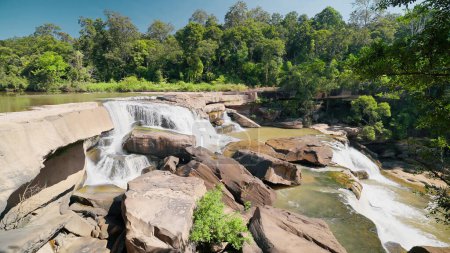 Photo for Beautiful waterfall Namtok Kaeng Sopha is a waterfall in Wang Thong District, Phitsanulok Province, Thailand. Kaeng Sopha is a tiered waterfall shaped like a stairway. Beautiful nature concept - Royalty Free Image