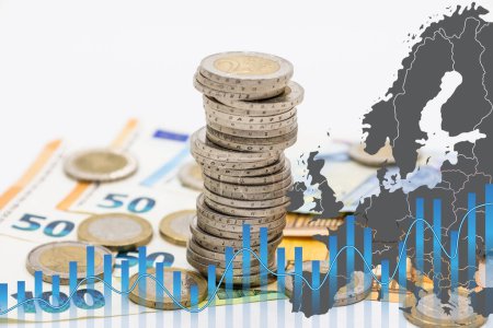 Photo for Pile of coins on euro banknotes and graph chart. High electricity and energy market prices concept. - Royalty Free Image