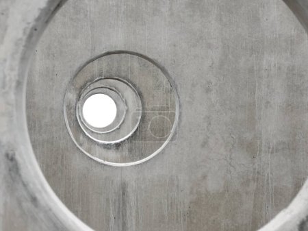 Photo for Construction as art: an unusual, aerial view through concentric holes in concrete beams. Geometry in construction. Using a drone to inspect construction progress. - Royalty Free Image