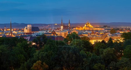 Photo for Panoramic, very detailed, evening  cityscape. Illuminated historical centre of city Olomouc in blue hour, UNESCO site, ancient town and tourist spot in Central Moravia, Czech Republic. - Royalty Free Image