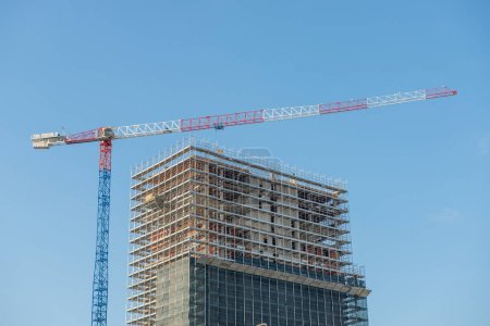 Photo for Milano Italia 4 dicembre 2019:Crane completing the skyscraper La Torre Libeskind or Torre PwC which is part of the CityLife project - Royalty Free Image