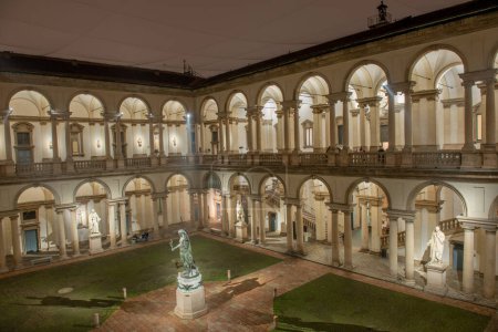 Photo for Milan Italy December 17 2022: Cloister of the Pinacoteca di Brera illuminated at night - Royalty Free Image