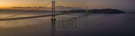 Photo for Panoramic aerial view of long suspension bridge with dawn color. High quality photo - Royalty Free Image