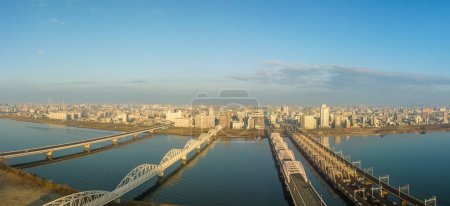 Photo for Series of bridges over the Yodo River in central Osaka in early morning. High quality photo - Royalty Free Image