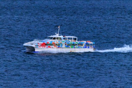 Photo for High Speed Ferry Boat Takes Passengers to Mainland Akashi Port. High quality photo - Royalty Free Image