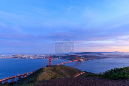 Photo for Red suspension bridge across Golden Gate to San Francisco after sunset. High quality photo - Royalty Free Image