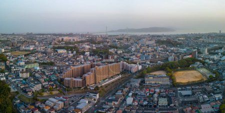 Photo for Aerial view of Akashi City buildings and bridge to Awaji Island at sunset. High quality photo - Royalty Free Image
