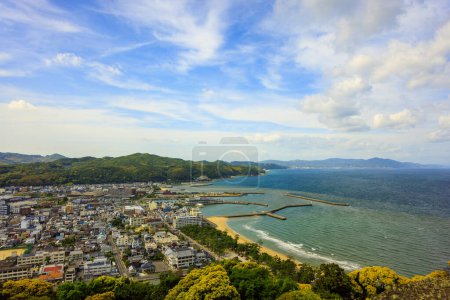 Photo for Clouds over beachfront town of Sumoto on Awaji Island on sunny day. High quality photo - Royalty Free Image