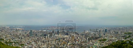 Photo for Panoramic view of downtown Kobe City, Port Island, and harbor on sunny day. High quality photo - Royalty Free Image