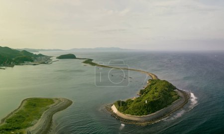 Photo for Concrete seawall and sandbar island at entrance to small coastal harbor. High quality photo - Royalty Free Image