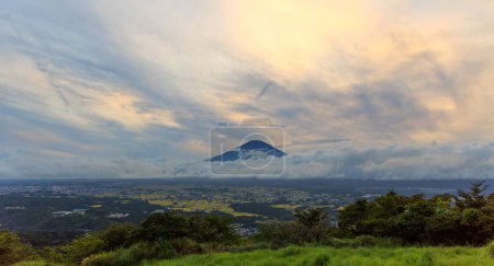 Photo for Sunset color in clouds and sky over Mt. Fuji and green summer landscape. High quality photo - Royalty Free Image