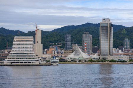 Photo for Kobe, Japan - September 23, 2023: Hotel and tower buildings on city waterfront by Mt. Rokko. High quality photo - Royalty Free Image