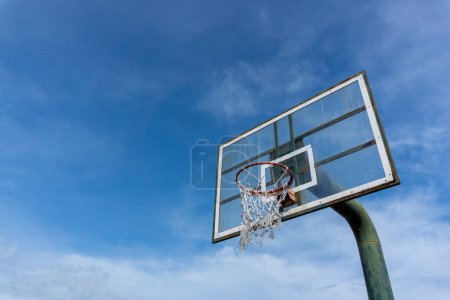 Photo for Low angle view of basketball ring on sky background. Outdoor basketball hoop. Net and rim - Royalty Free Image