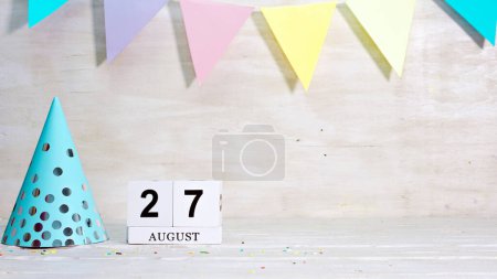 Photo for Birthday August 27 on the calendar. Happy birthday card with date copy space. Holiday decorations for congratulations, place for text - Royalty Free Image