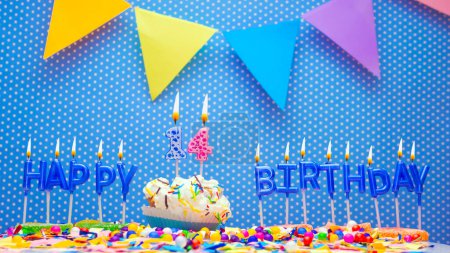 Foto de Happy birthday candle letter word for years old. Copy space Happy birthday greetings for 14 years, lit candles with holiday decorations. Beautiful holiday card. - Imagen libre de derechos