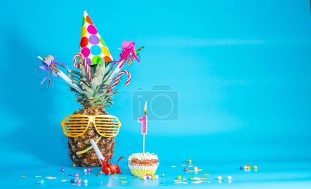 Photo for Creative congratulations on one year old for a child. Pineapple with glasses in festive decorations. copy space. 1 year old birthday. Merry fruit birthday card.. - Royalty Free Image