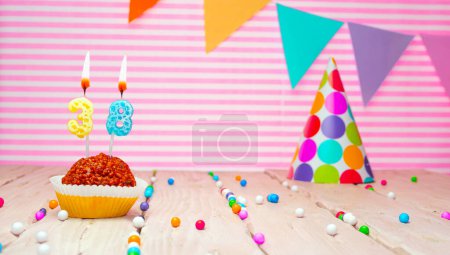 Foto de Happy birthday for 38 years old. Festive background with muffin. Copy card birthday for thirty eight years on a pink background - Imagen libre de derechos