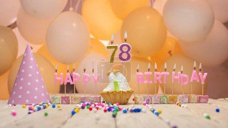 Photo for Beautiful background happy birthday number 78 with burning candles, birthday candles pink letters for seventy eight years. Festive background with balloons - Royalty Free Image