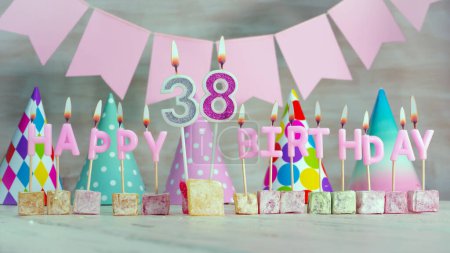 Foto de Happy birthday number 38 in pink pastel colors for a girl or woman. Happy birthday greeting card. - Imagen libre de derechos