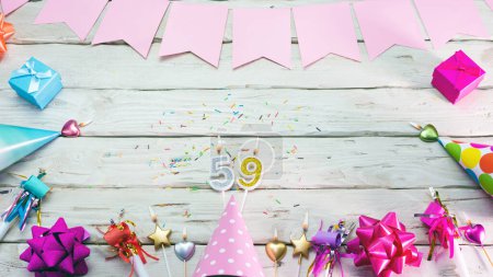 Happy birthday number 58. Copyspace. Beautiful card in pastel pink colors for a woman or a girl. Decorations festive place for your text