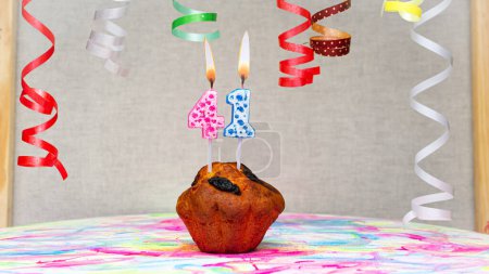 Foto de Happy birthday background with muffin with beautiful decorations with number candles  41. Colorful festive card happy birthday with a number. Anniversary copy space - Imagen libre de derechos