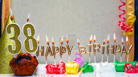 Foto de Happy birthday background with golden candles and decorations with candles burning number  38. Colorful festive card happy birthday with a number. Anniversary copy space - Imagen libre de derechos