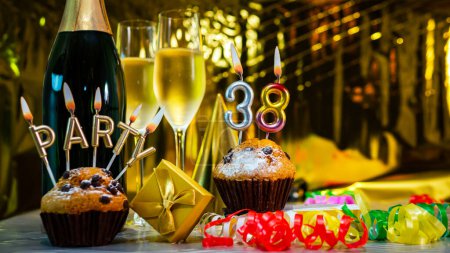 Foto de Happy birthday background with champagne glasses with number cake  38. Beautiful birthday card with decorations copy space. - Imagen libre de derechos