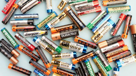 Photo for Lots of mix of AA and mini batteries. Batteries for devices. Alkaline batteries GP super, GP ultra, Duracell, Kodak, Toshiba, Camelion, Videx, Energizer, Westinghouse, copyspace. Editorial Ukraine 12.02.2023 - Royalty Free Image