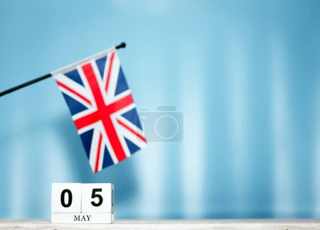 May Calendar With British Flag With Number  5. Calendar cubes with numbers. Space copy.