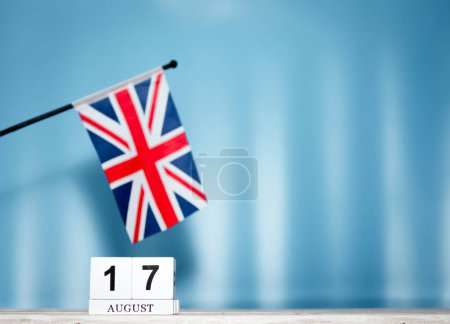 Calendar August With British Flag With Number 17. Calendar cubes with numbers. Space copy.