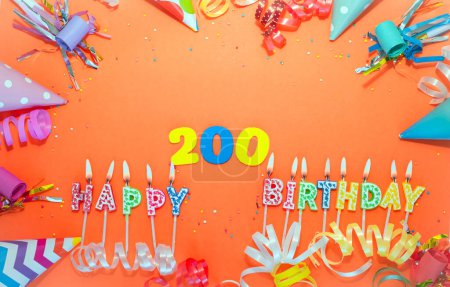 Photo for Top view birthday background with number  200. A beautiful holiday postcard on a colorful background with decorations. Anniversary congratulations with a number. Words from candles birthday. - Royalty Free Image