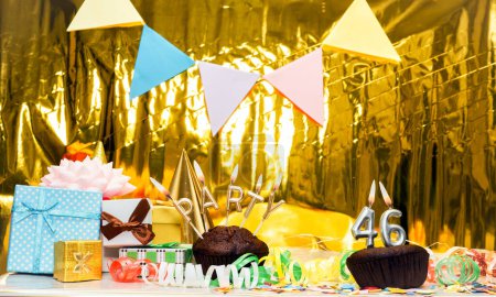 Date of Birth  46. Festive party word from candles. Scenery with gift boxes, greeting card anniversary gold background. Birthday. copy space