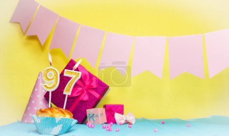 Date of birth with cake and number  97. Colorful card happy birthday for a girl. Copy space. Anniversary card pink. Congratulations on the decorations are beautiful.