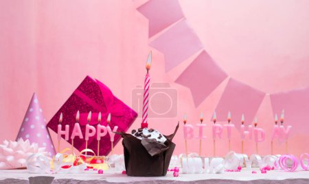 Background card date of birth for a girl. Anniversary. Beautiful festive background with candles. Women's congratulations card with a cake. Happy birthday in pink. copy space