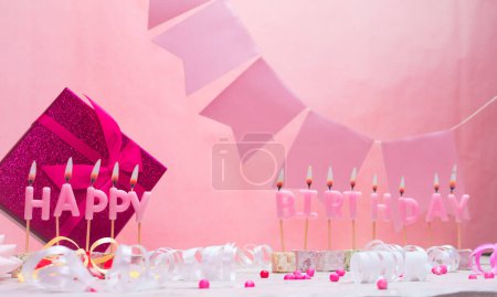 Background card date of birth for a girl. Anniversary. Beautiful festive background with candles. Women's congratulations postcard. Happy birthday in pink. copy space