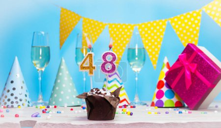 Date of birth for woman or girl with birthday box. Pie with number of candles  48. Anniversary greeting card with champagne. Holiday decorations. Happy birthday