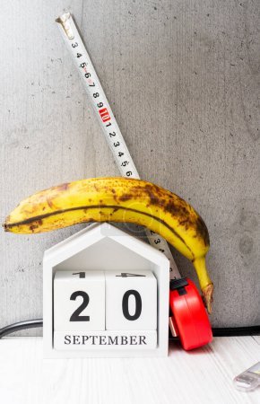 Weight loss concept, banana with meter for measuring waist. Banana with tape measure
