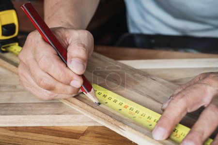 Photo for Tape measure with linear-measured markings on wooden background, DIY maker and woodworking concept. selective focus. - Royalty Free Image