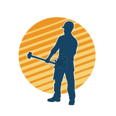 Silueta de un trabajador en acción posar usando su herramienta de martillo de trineo.