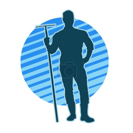 Silhouette eines männlichen Arbeiters, der eine Gartengabel oder ein Mahlgabelwerkzeug trägt