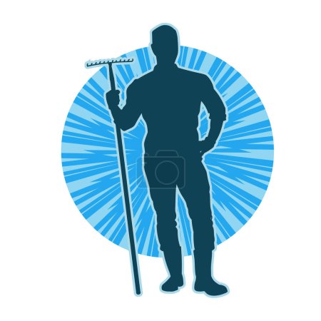 Silueta de un trabajador masculino que lleva tenedor de jardín o herramienta de tenedor de tierra